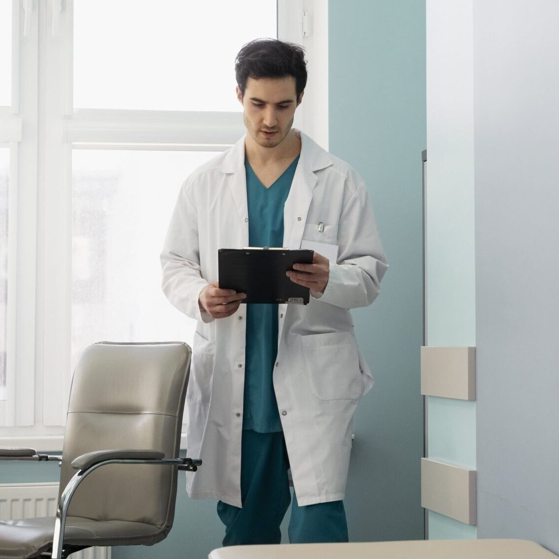 full shot doctor holding document 2 min scaled e1730763709979