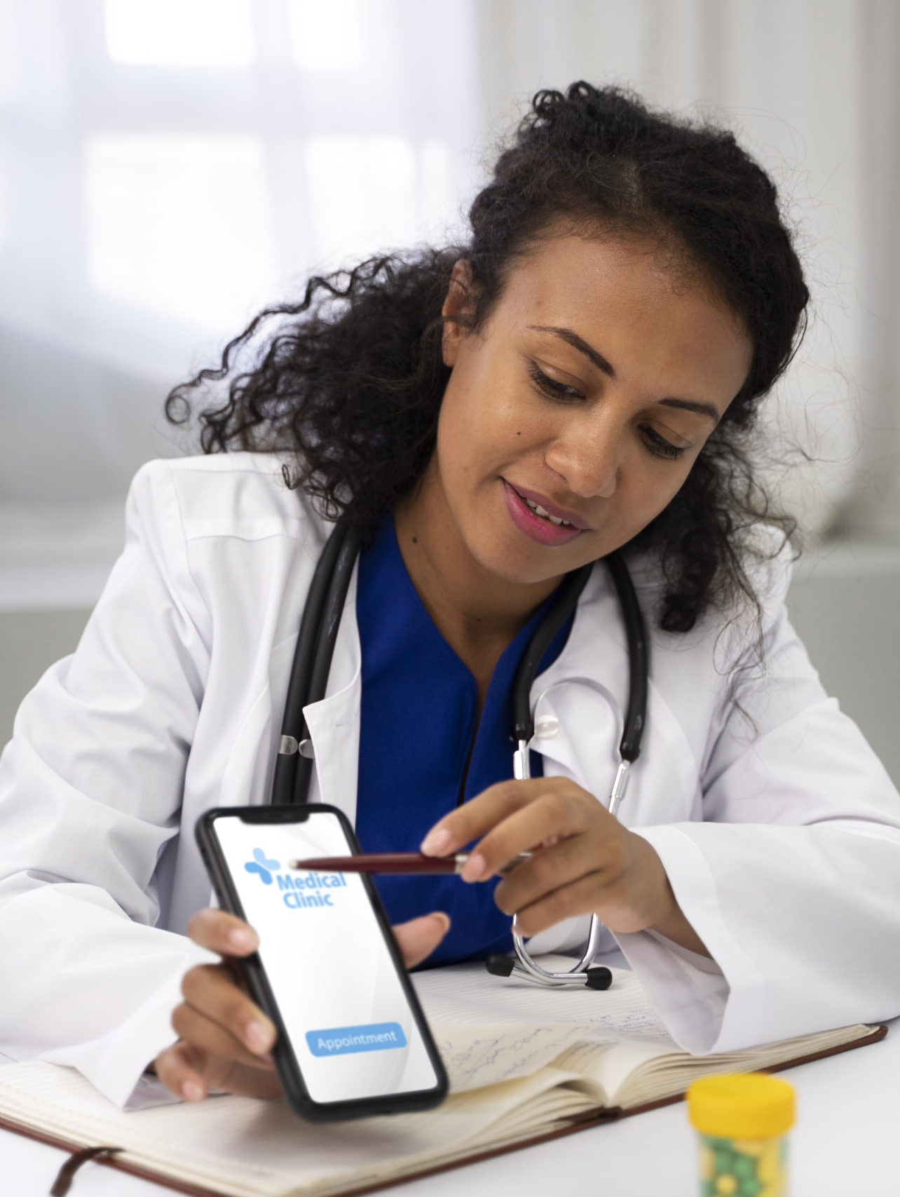 medium shot doctor holding smartphone scaled e1781388917450