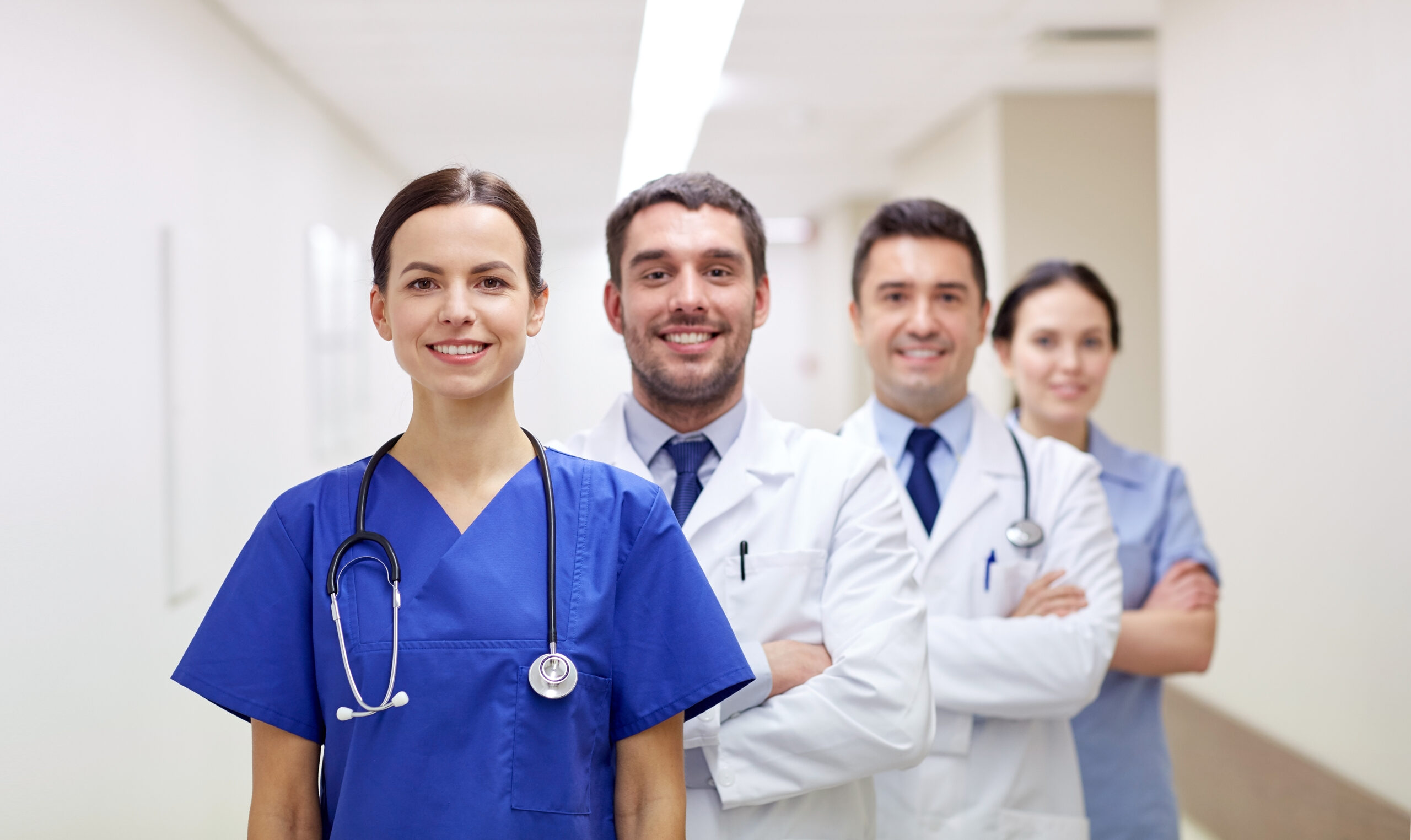 clinic profession people health care medicine concept group happy medics doctors hospital corridor scaled